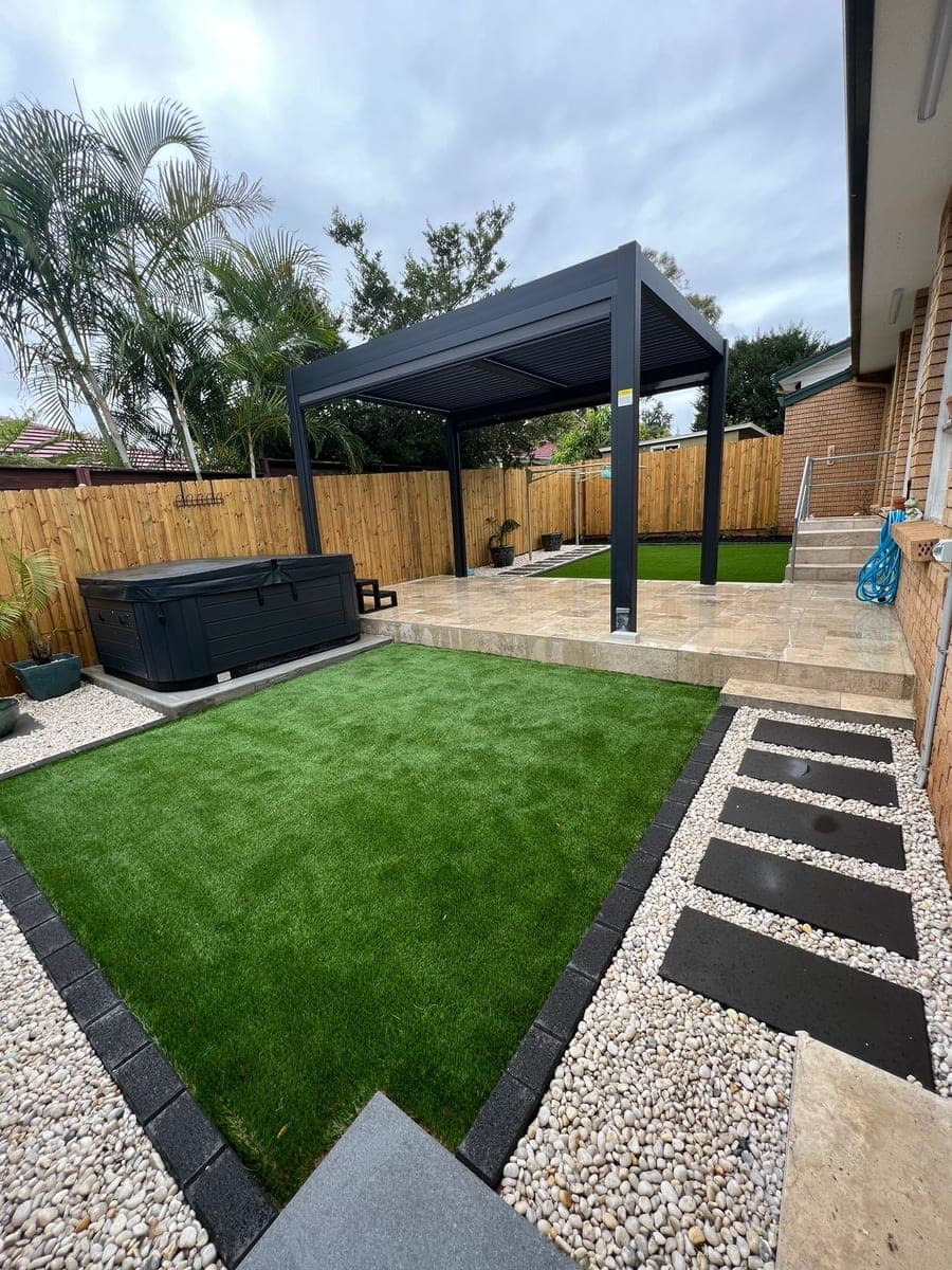 After - Main backyard transformation from cluttered yard to elegant turf and pergola