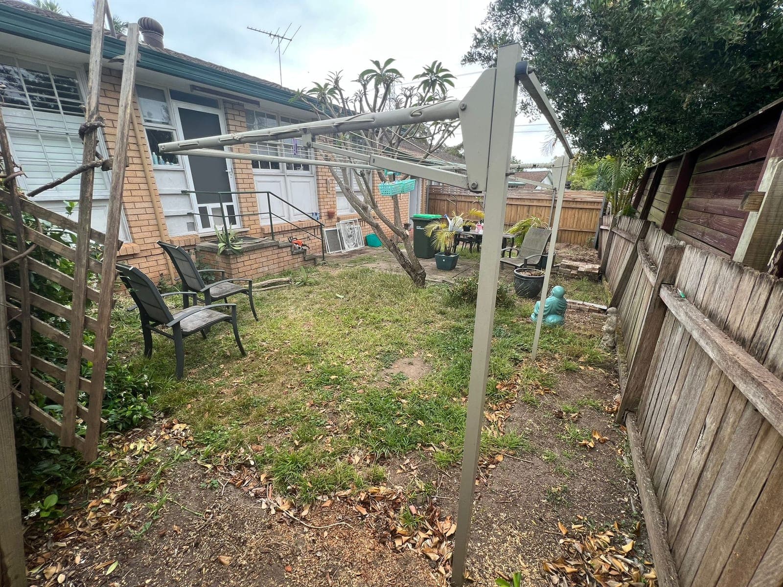 Before - Wide view showing complete transformation with stepping stones and garden edging