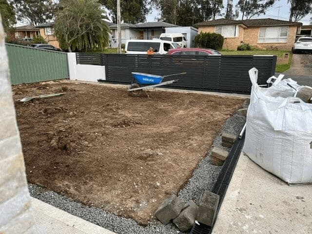 Before - Front yard transformation with turf and stepping stone pathway