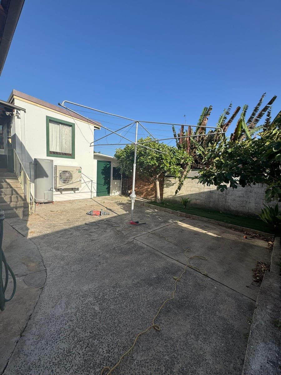 Before - Yard transformation from concrete to lawn