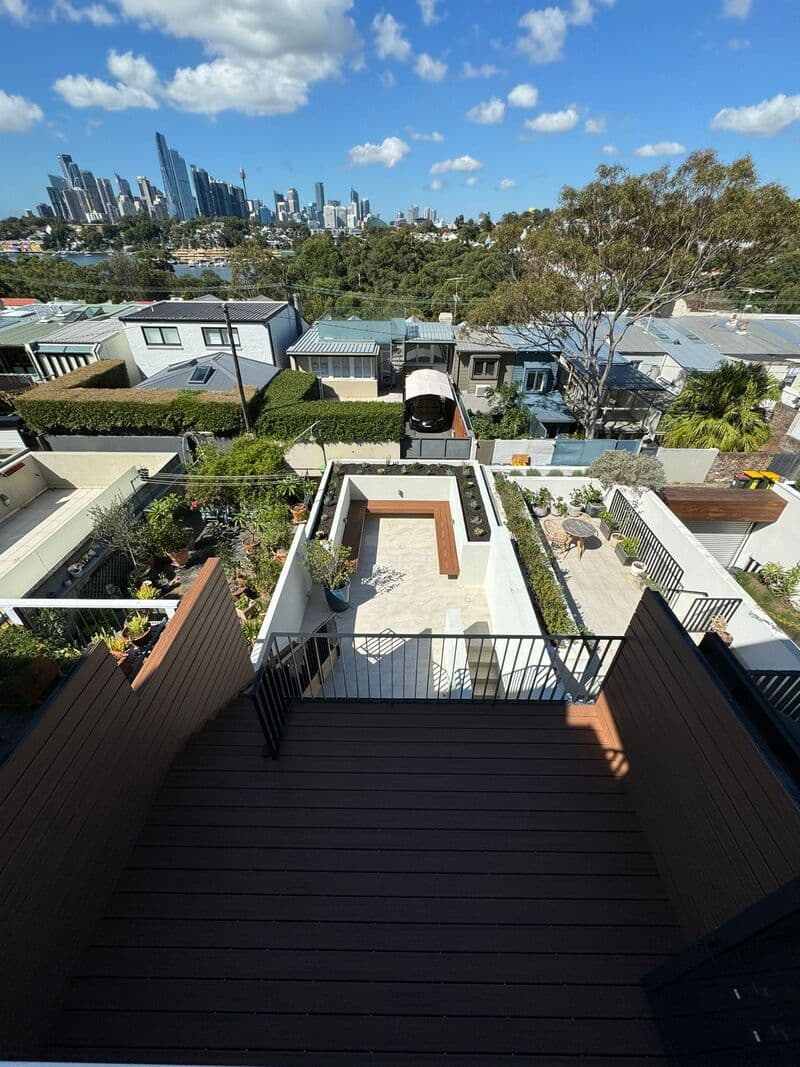 After - Transformation of the main outdoor area with new composite decking and privacy screens