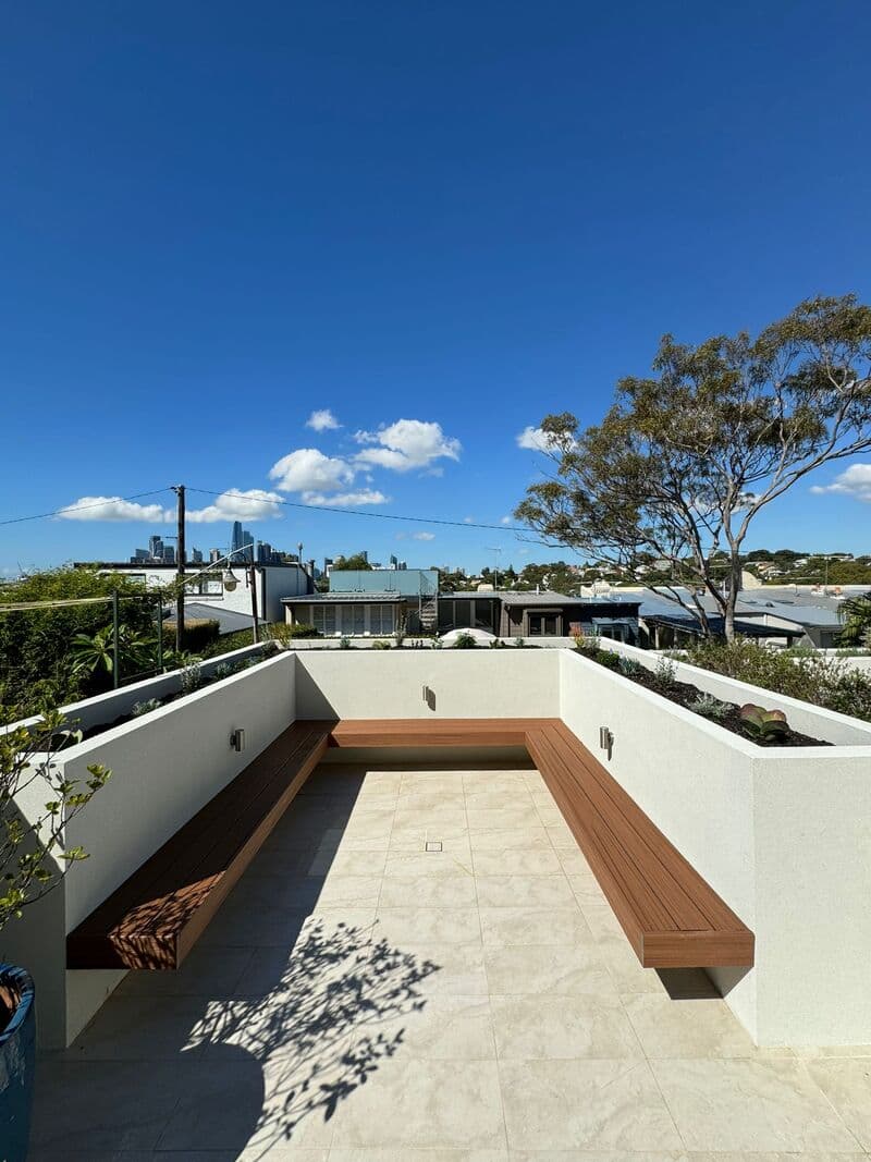 Design detail: Junction between tiled area and composite decking with seamless transition