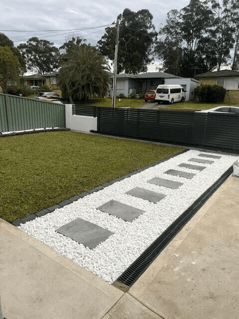Premium turf installation showing lush, green lawn in the front yard
