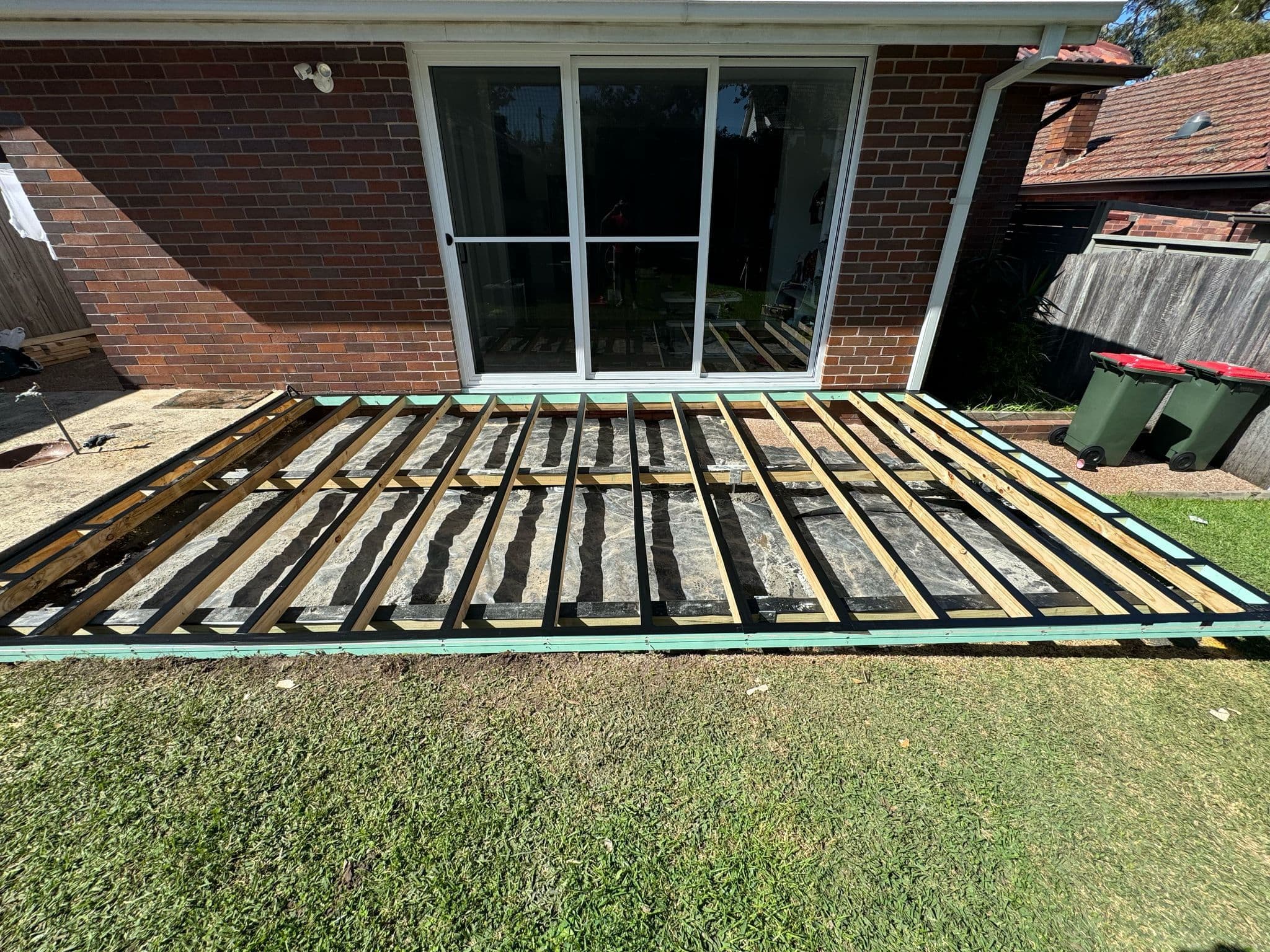 Insulated pergola providing shade over the deck