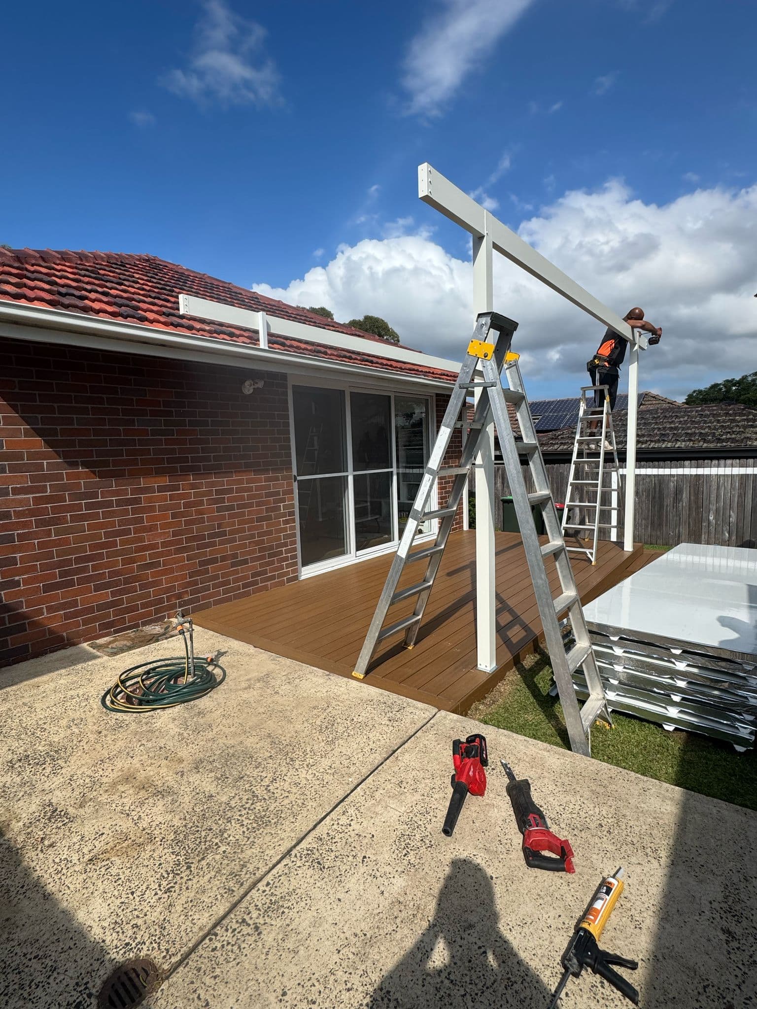 Side view of the completed decking and pergola
