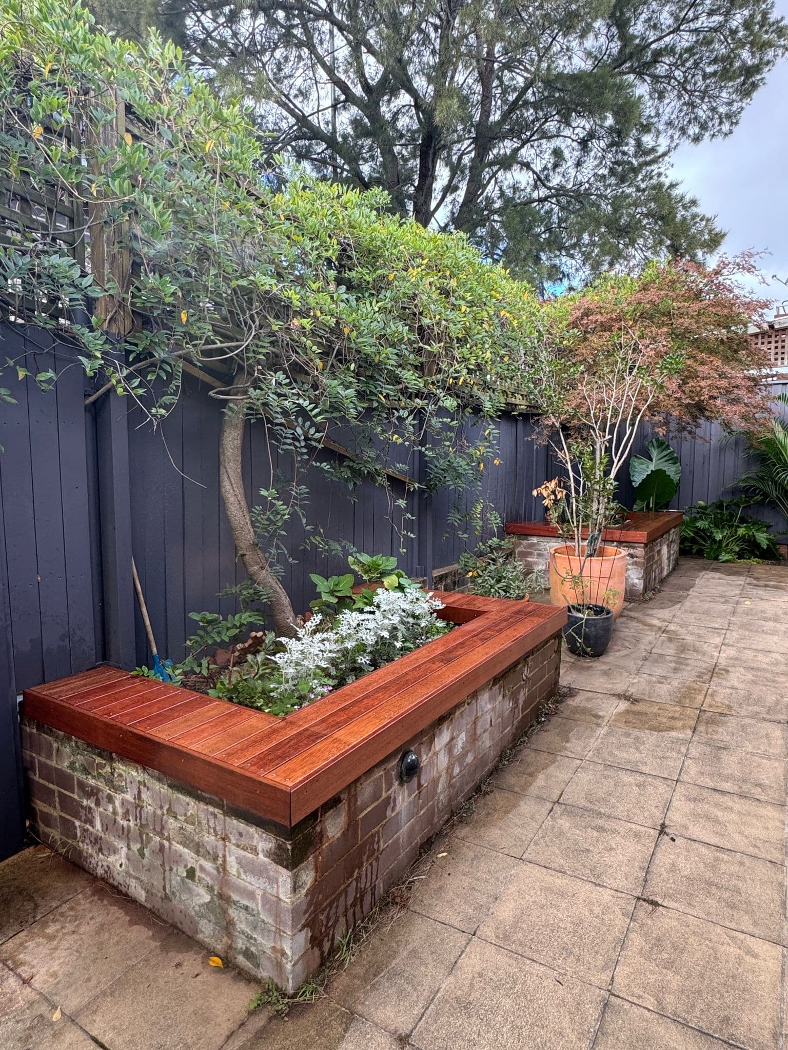 After - Transformation of the main seating area with custom Merbau hardwood bench installation