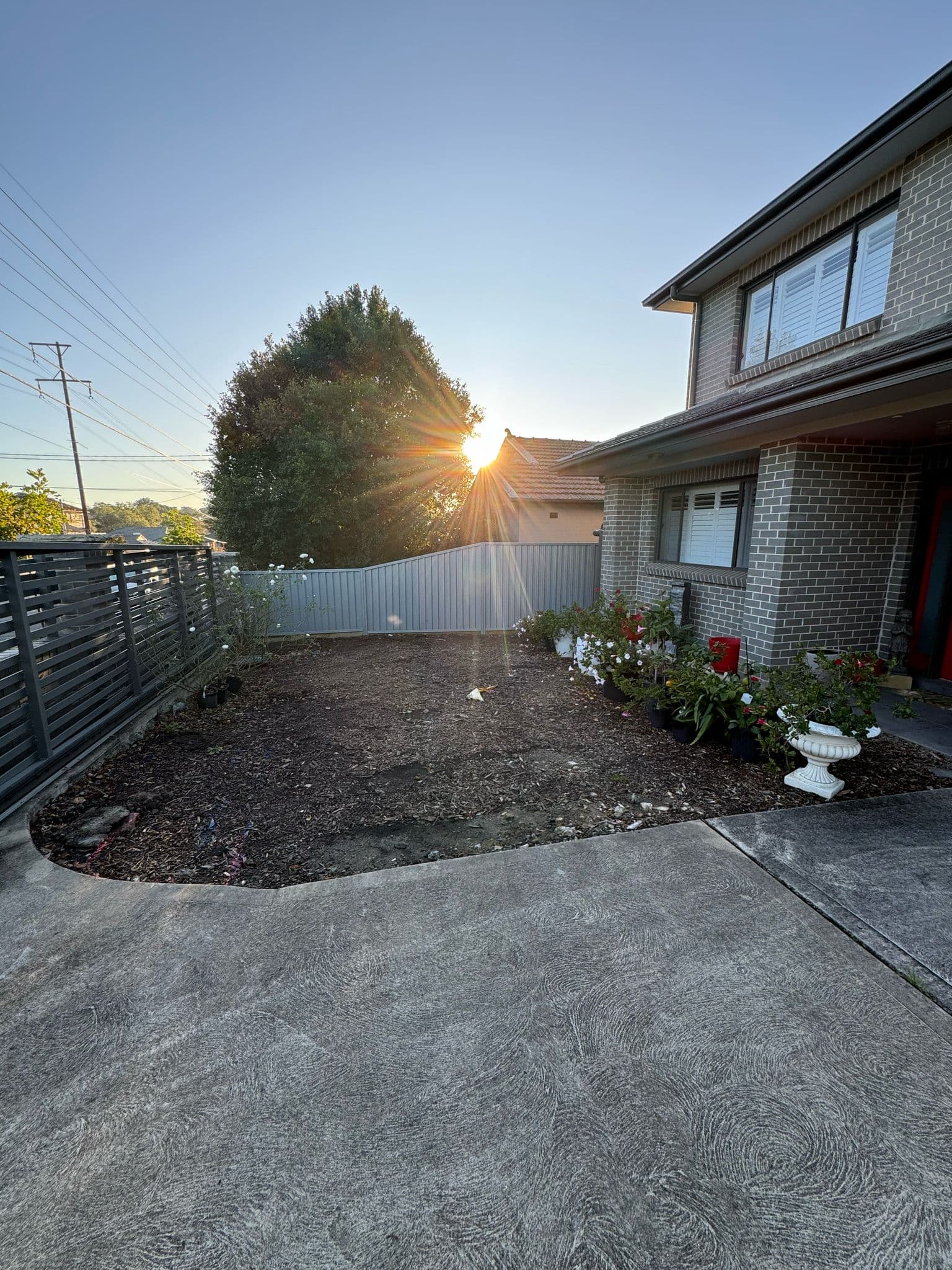 Before - Transformation of the front yard area with synthetic turf, planter boxes and garden edging