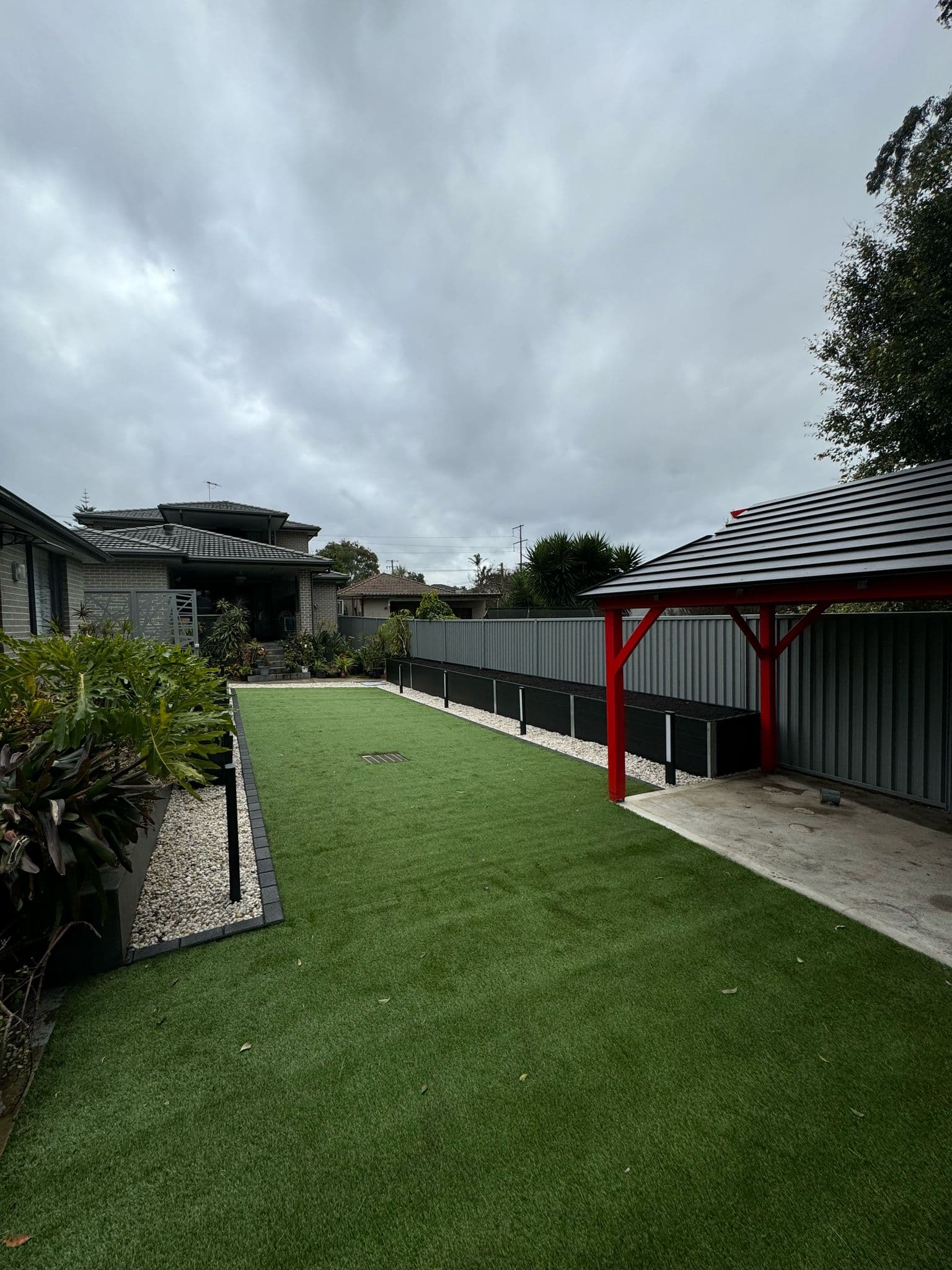 Side view of the property showing the connection between front and back yards