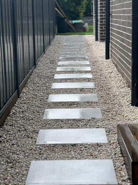 Full length view of the side access pathway with stepping stones and Cowra pebbles