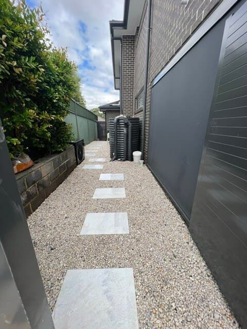 Alternative angle showing the pathway's integration with the existing landscaping