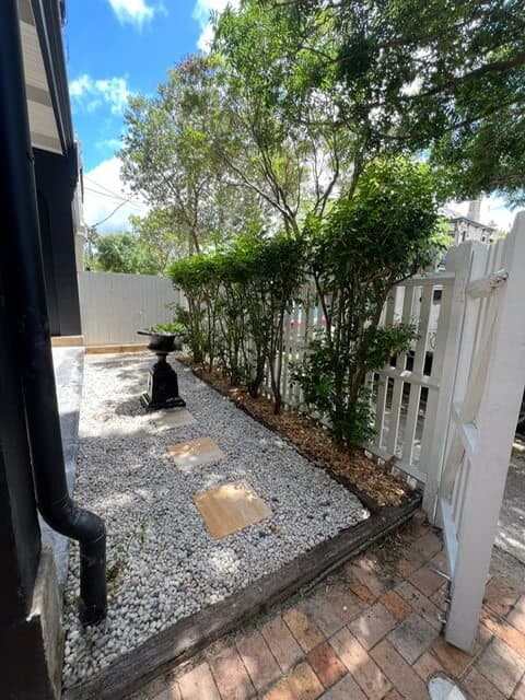 Detail of the herringbone paver installation showing the precise pattern and craftsmanship