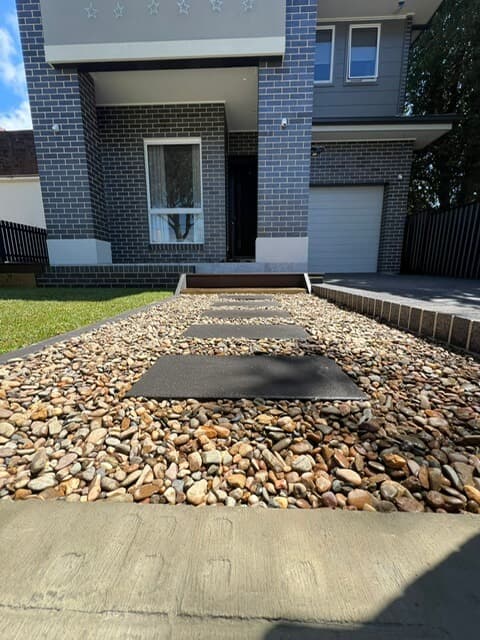 Modern aluminium fencing installation along the property boundary providing privacy and security