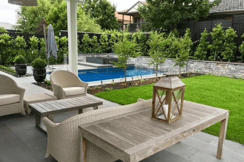 Complete outdoor makeover featuring modern entertaining area with timber deck and landscaping