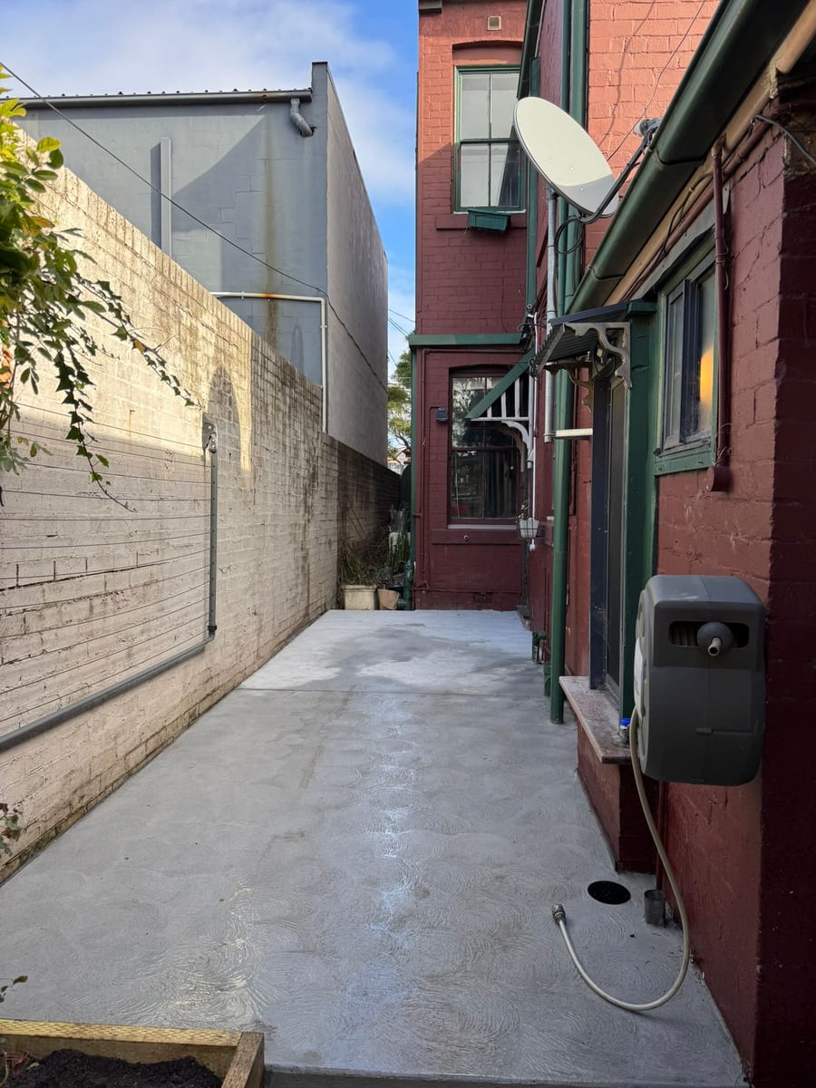 Concrete side-access path between houses in Tempe