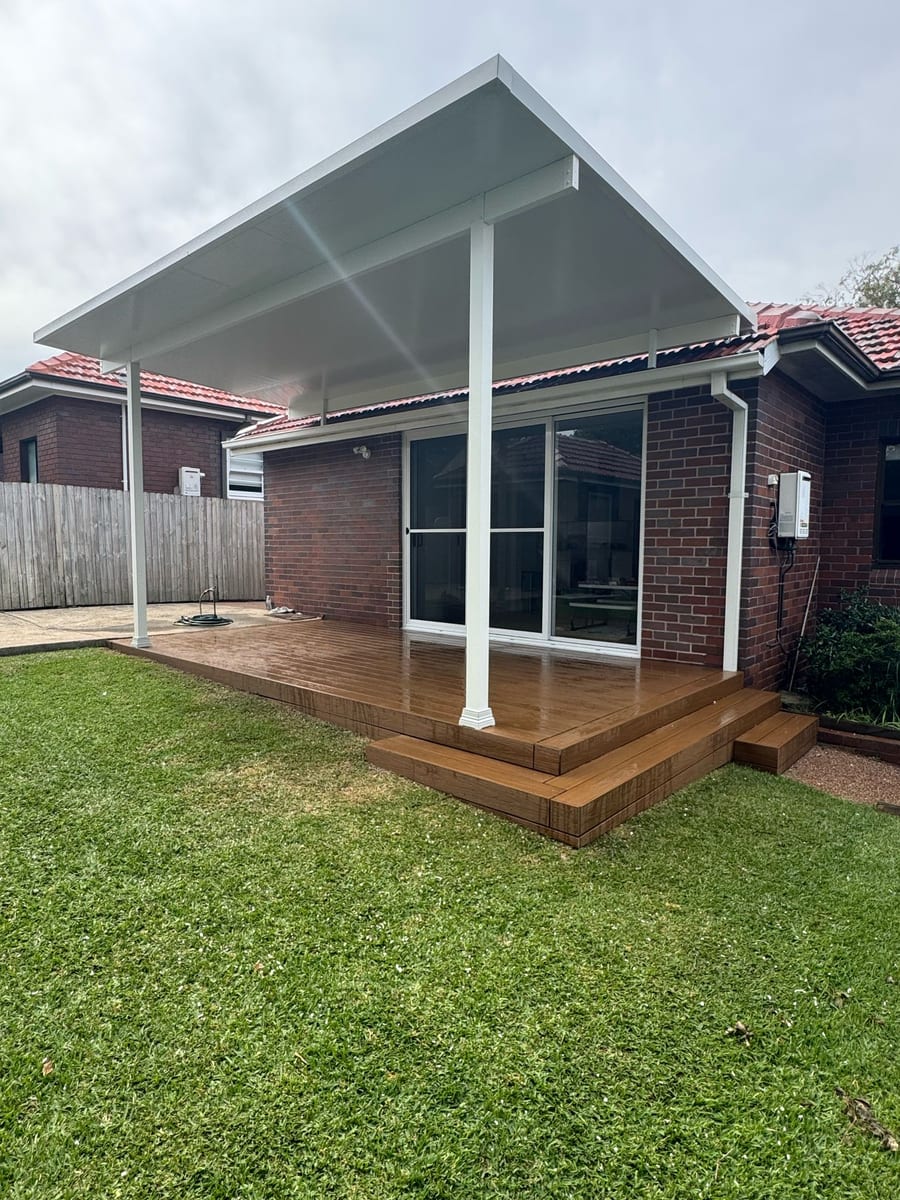 Composite deck and built steps beneath a pergola in Dulwich Hill
