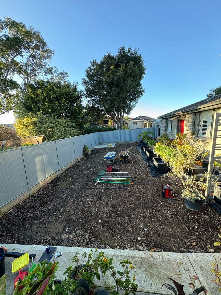 Before - Backyard makeover with turf, pebbles, and pergola